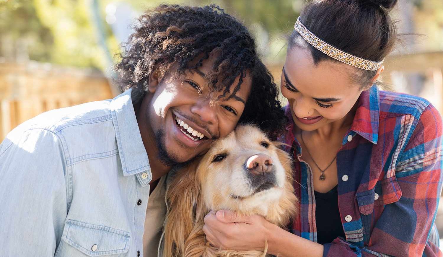 happy couple petting dog 100622 aba23ecfa8804ba9b88afb50ec9e7567